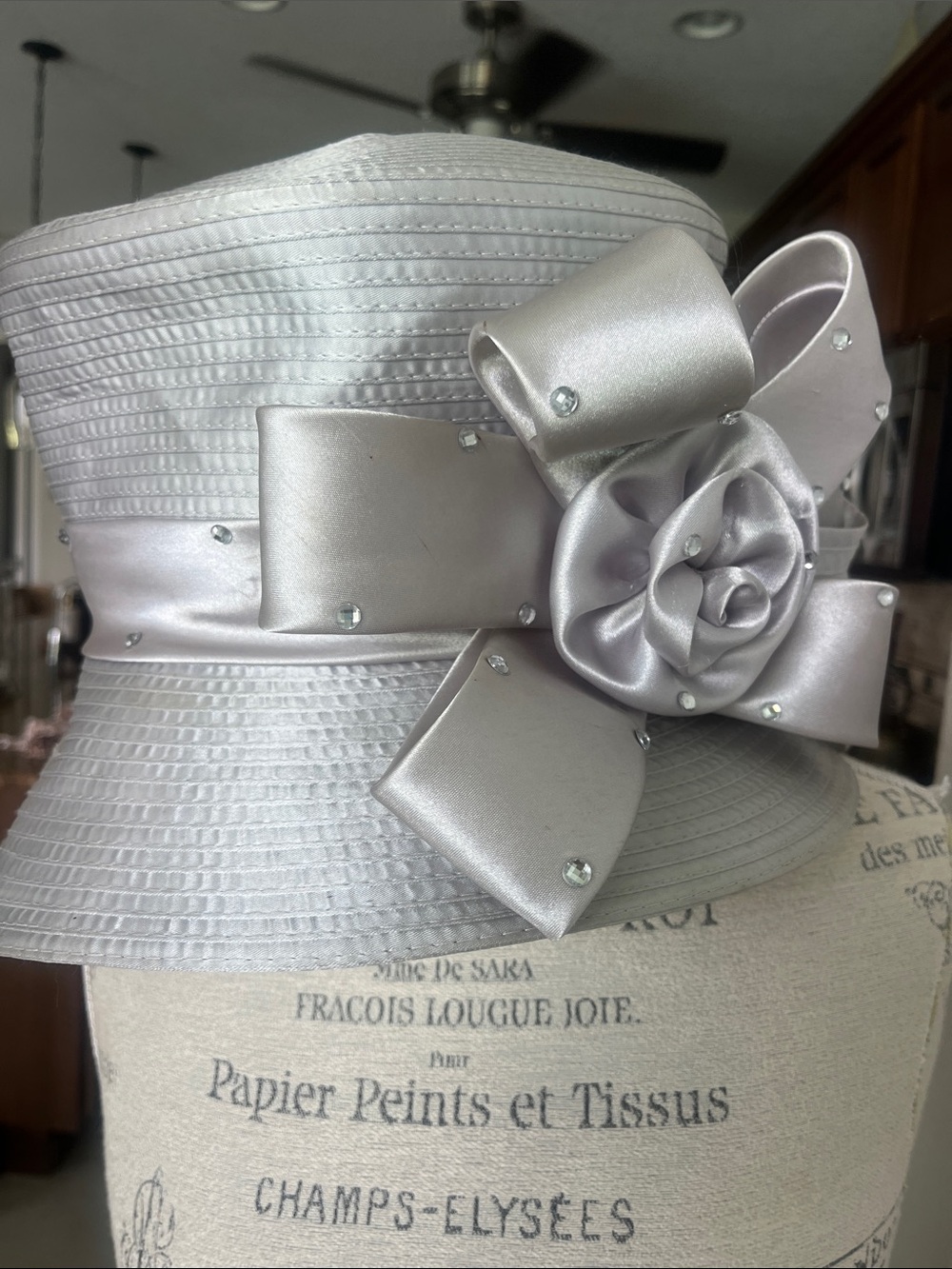 The Swan Hat Co silver high crown church Derby oversized bow hat